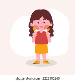 Girl eating and holding spoon and fork