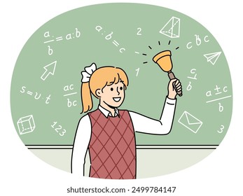 Girl elementary school student with bell stands near chalkboard with mathematical formulas and examples. Happy schoolgirl with bow on blond hair makes call, for concept back to school