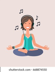 The girl is engaged in yoga in the lotus position. A girl meditates and listens to music on headphones.