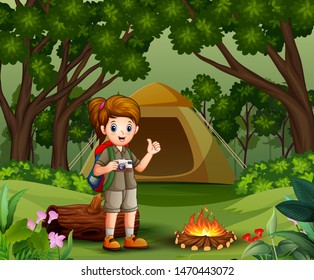 Girl explorer with scout uniform camping in the forest