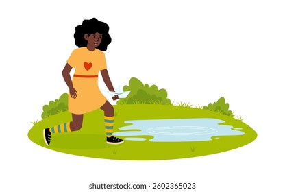 Girl exploring nature while walking near a small pond on a sunny day in a park