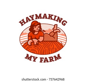 Girl farmer resting in the field on a haystack.