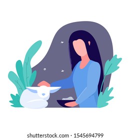 Girl feeds a fennec fox. Concept of professions veterinarian, zoo worker, volunteer saving exotic animals