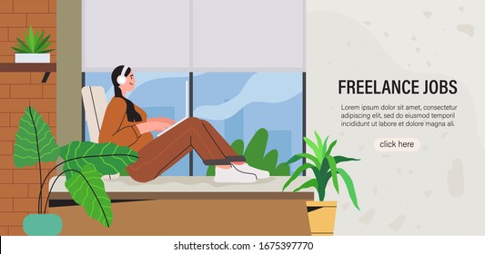 Girl freelancer sitting in her home office and working on laptop on project and communicate online with colleagues and fellow freelancers. Concept of comfortable working space, distant empoyee.