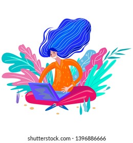 Girl in the garden working at the laptop. Concept of education or freelancers and remote work