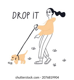 The girl gives a hand signal to the puppy.
The dog is on leash. Puppy training. Training dogs ooutside.