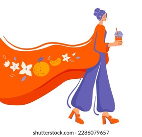The girl with a glass of coffee goes. Woman with a glass of bubble tea. Blossoming tangerine pattern. Cold tea to go in the summer heat.