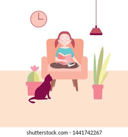 A girl with glasses sits in an armchair and reads a book. Next to her plants and a cat. A clock is hanging on the wall. A lamp lights the room.