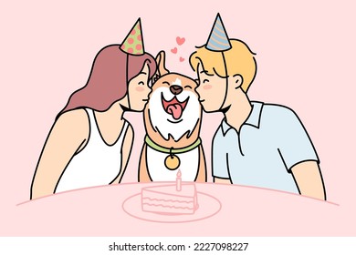 Girl, guy sit at festive table with cake, kiss happy dog in center. Family canine pet celebrates his first birthday surrounded by loving young owners in party hats. Vector colored linear illustration.