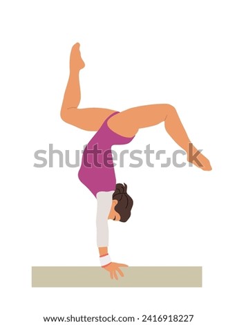 Girl gymnast doing exercise on balance beam.