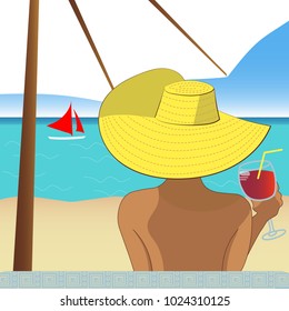 A girl in a hat on a beach relaxing and drinking sangria under an umbrella.