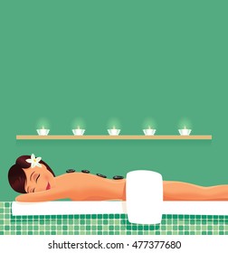 Girl having stone therapy.
