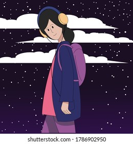 A girl in headphones listens to music walking against the backdrop of the night starry sky.