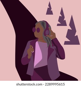 A girl with headphones is walking down the road.