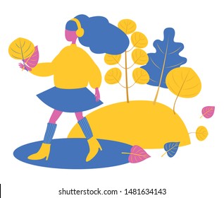 Girl in headphones walks in the fall. She holds autumn leaves in her hands. In the background a landscape with trees. Under her feet a puddle and flying leaves. Bright vector modern flat illustration 