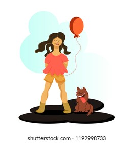 A girl holding a baloon standing with her dog and smiling