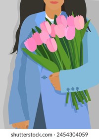 The girl is holding a bouquet of tulips. Pink flowers in the hands of a woman.