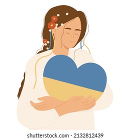 Girl holding and hugging a heart with the colors of the flag of Ukraine. Pray for Ukraine. Support for Ukraine. No war. Support against fighting. 