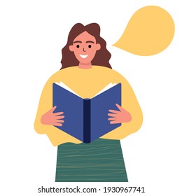 Girl holding a paper book in her hands, reading aloud. A girl reads a book