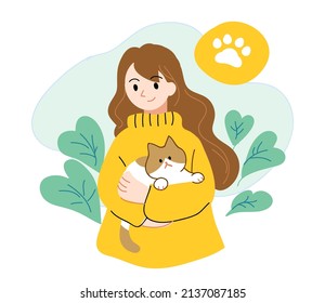 Girl holding pet cat with warm atmosphere on natural background