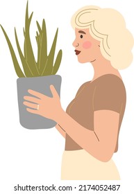 The girl is holding a potted plant in her hands.