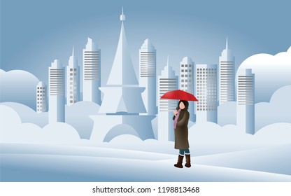 Girl holding red umbrella with city on background in winter season, paper art and craft style