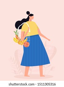 Girl is holding string bag with vegetables and fruits. Shopping with eco bag. Zero waste, vegetarianism, environment preservation, ecology protection concept