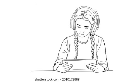 A girl holding a tablet, online learning during a pandemic to suppress the transmission of the virus