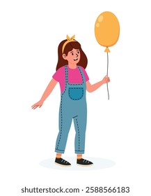 Girl holding a yellow balloon while wearing overalls and enjoying a sunny day outdoors