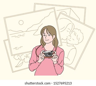 A girl holds the camera in her hand and smiles. Line sketch picture background. hand drawn style vector design illustrations. 