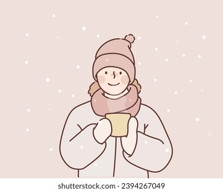 girl holds a cup with a warm drink in the cold season. Winter clothes on the child. Hand drawn style vector design illustrations.