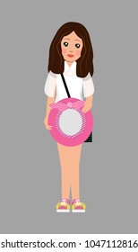 girl holds a hat with a bow in her hands and smiles