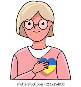 The girl holds a heart with the colors of the flag of Ukraine. the concept of "stay with Ukraine". Support for Ukraine. There was no war. Ukraine in the heart.