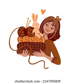 The girl holds in her hands a sweater,  yarn and a knitted toy. Knitting, crochet, hobby. Vector illustration.