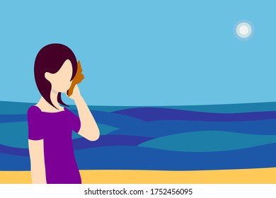 Girl holds a shell in her hand and listens to the sound of the sea.