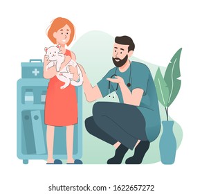 Girl Hugging A Cat At Veterinary Clinic Discussing With Veterinarian. Pet Health Care And Medical Concept