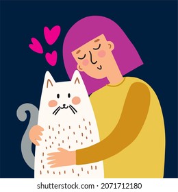 A girl hugs her cat