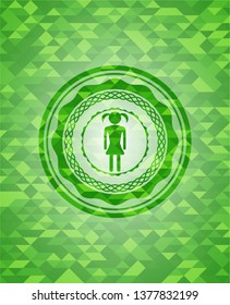 girl icon inside green emblem. Mosaic background