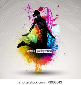 Girl jumping over ink splash background.