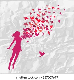 The girl jumping with swarm of birds.