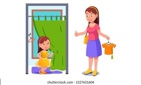 Niña tratando de vestirse en una habitación de taller 