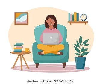 Girl with laptop sitting in the arm chair. Online work concept. Home office. Workplace. Freelance work, technology. Online education.	