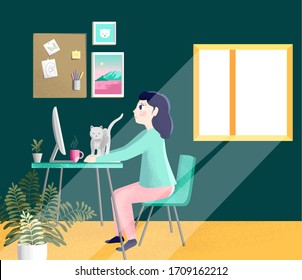 Girl with laptop is sitting at the desk. A freelancer is working at home, near her cat and plants. Woman at home in quarantine. 