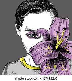 Girl with large flower from the person . Blooming pink lily . Beautiful girl with make-up .