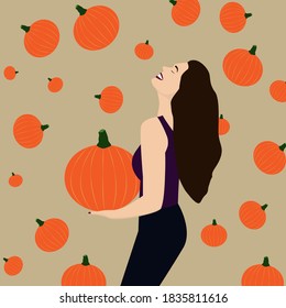 The girl laughs and holds a pumpkin. Happy Halloween mood. Happy Halloween. Girl surrounded by pumpkins. Trick or treat