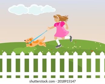 A girl is leading a dog in a green lawn with a white fence in front.blue sky background