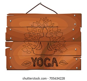 Girl with leaves on wooden plank background.  Lotus yoga pose - Padmasana. Women meditation. Fitness and gym. Sport.