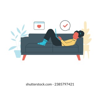 girl lie down on a couch while using laptop