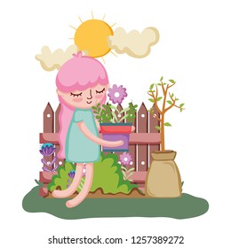 girl lifting houseplant with fence in the garden