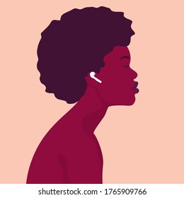 The girl listens to music on wireless headphones. Music therapy. Profile of a young African woman. Musician avatar side view. Vector flat illustration